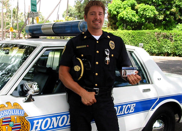 Police holding the International Driver's License Card